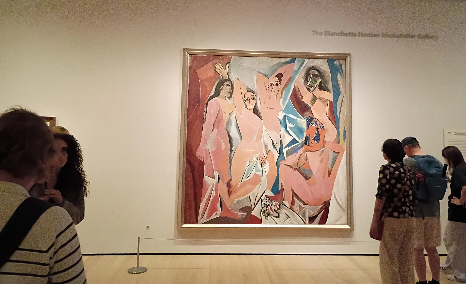Visitors admire Pablo Picasso's "Les Demoiselles d'Avignon" at the Museum of Modern Art in New York City.