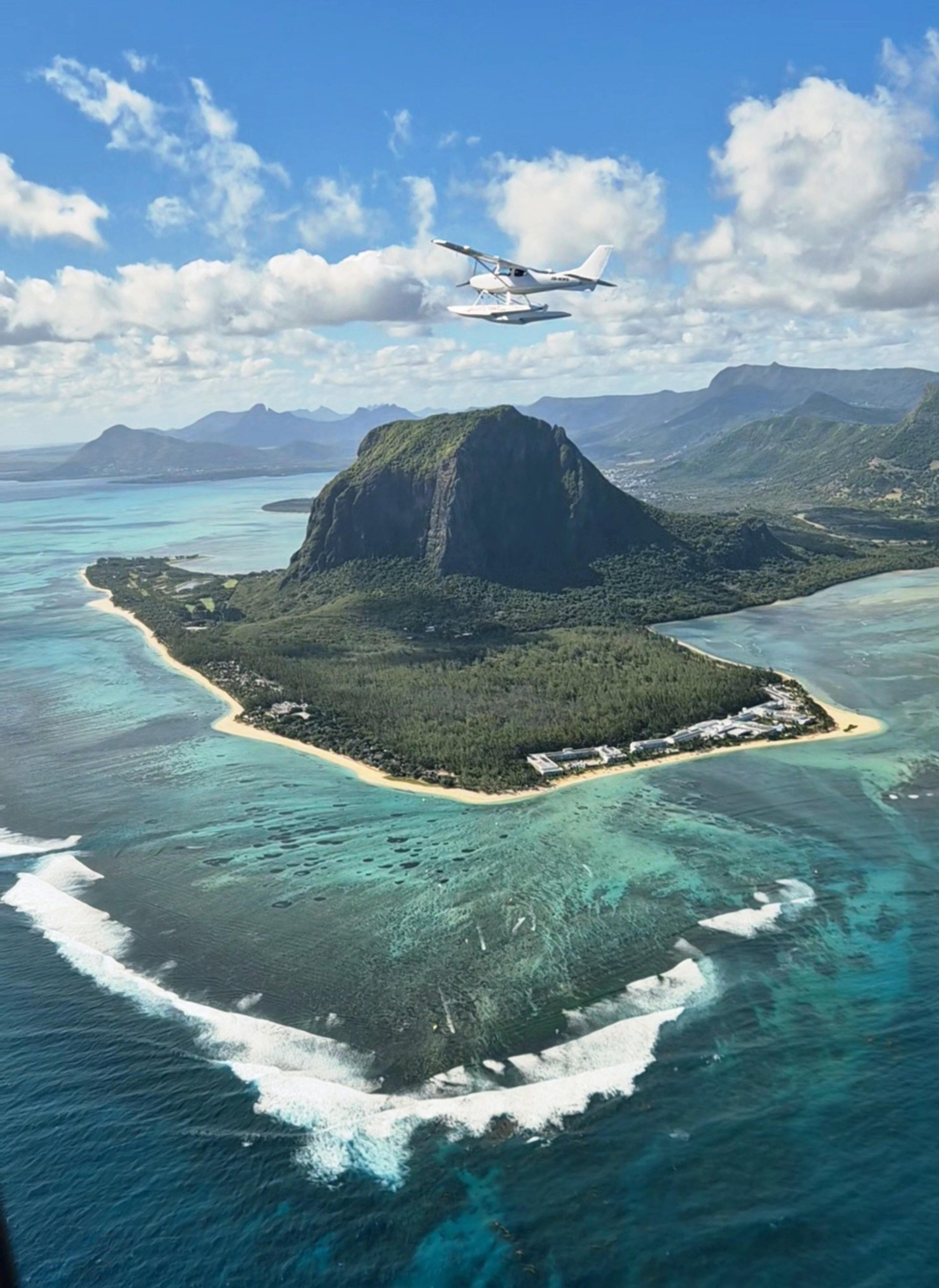 The plane flew so low, we waved to the people who had climbed the mountain