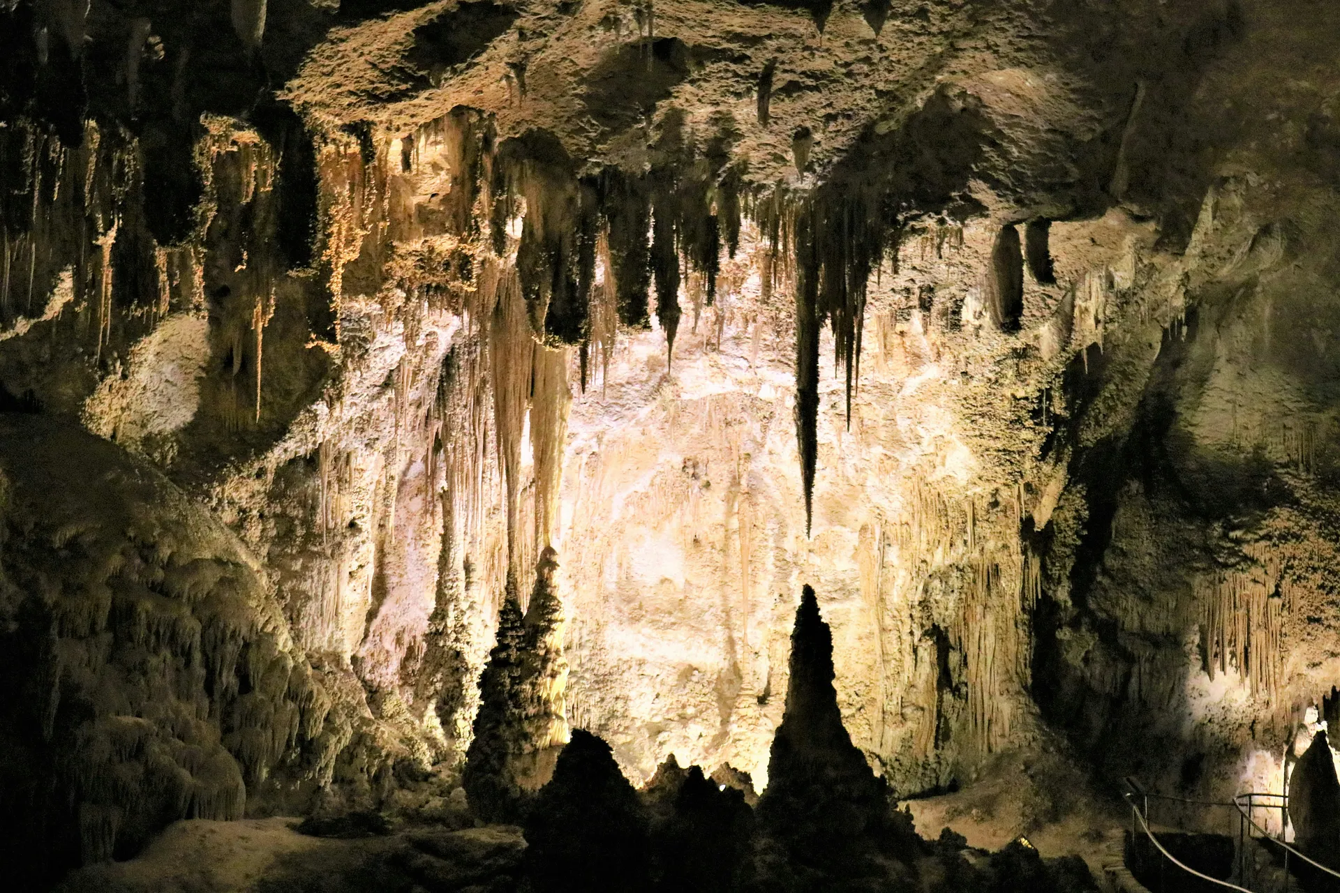 Majestic stalactites and stalagmites adorn the illuminated chambers of Carlsbad Caverns in New Mexico.