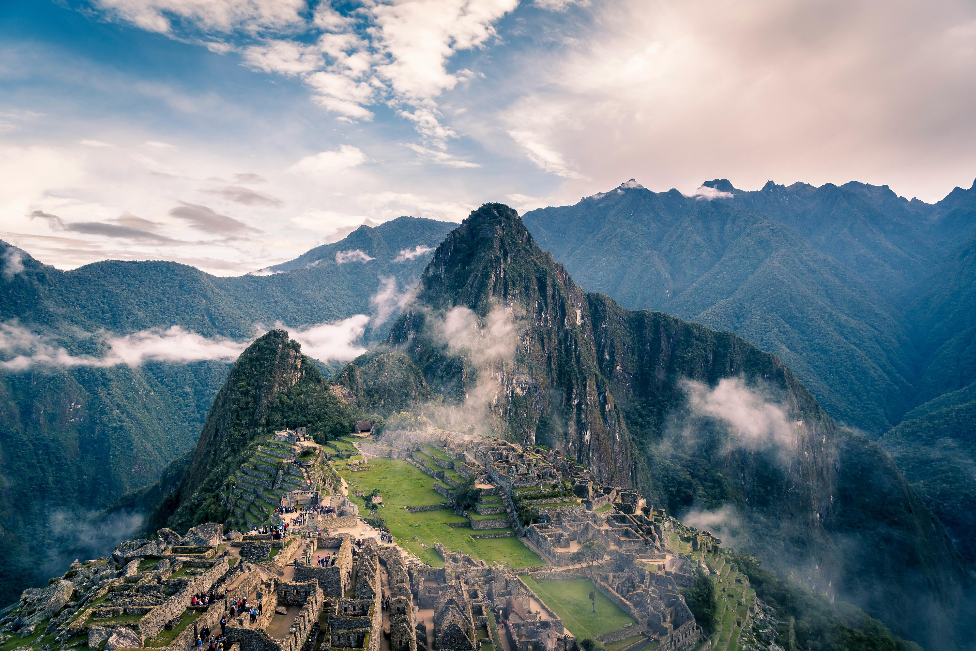 Machu Picchu stands majestically amidst the misty Andes mountains in Peru.