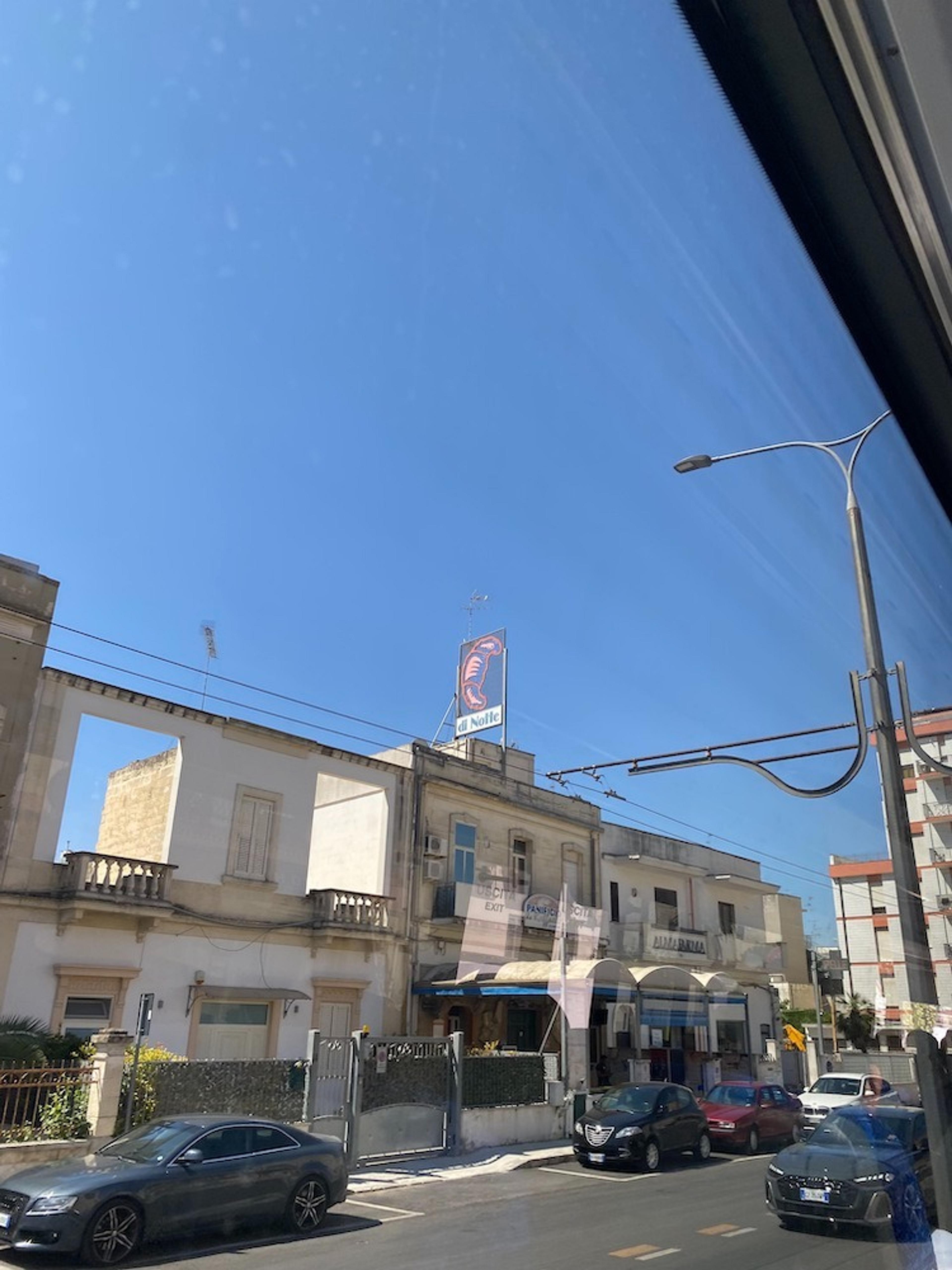 Photo of Italian street from the bus window