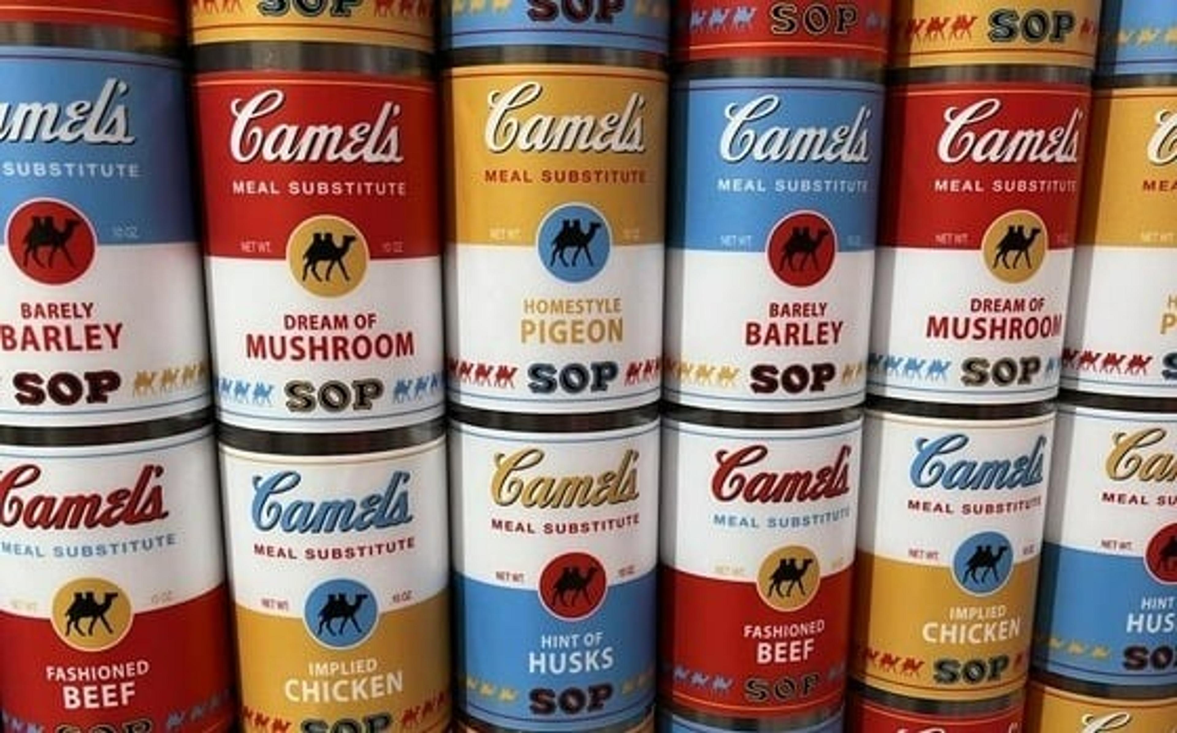 Colorful pop art soup cans reminiscent of Andy Warhol's style are neatly displayed, potentially in a modern art museum exhibit.