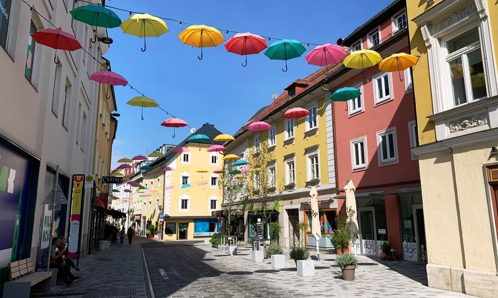 A street in Villach with umbrellas hanging across