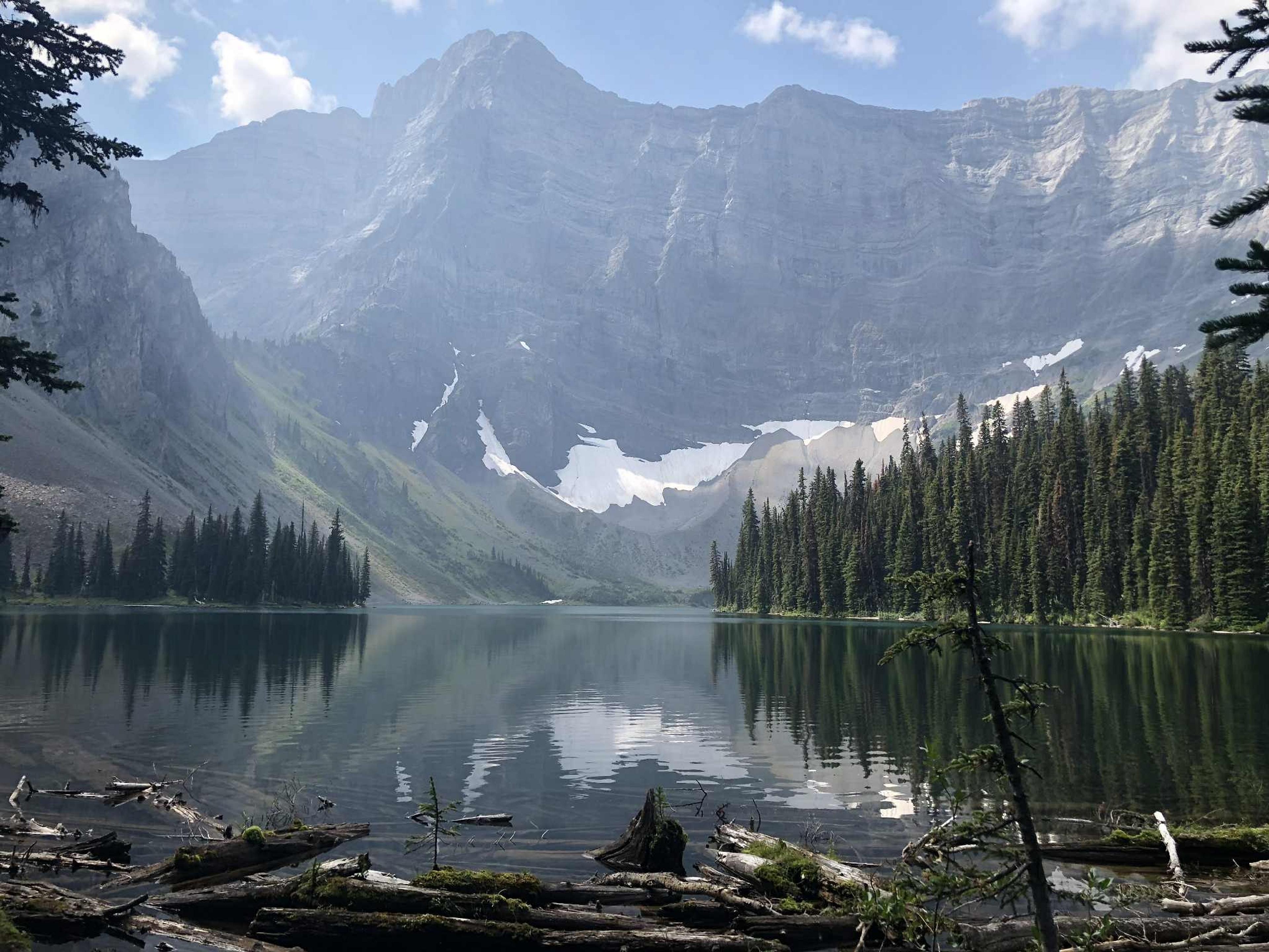 Rawson Lake, Kananaskis National Park, Canada, with towering mountain peaks reflecting on its calm waters.