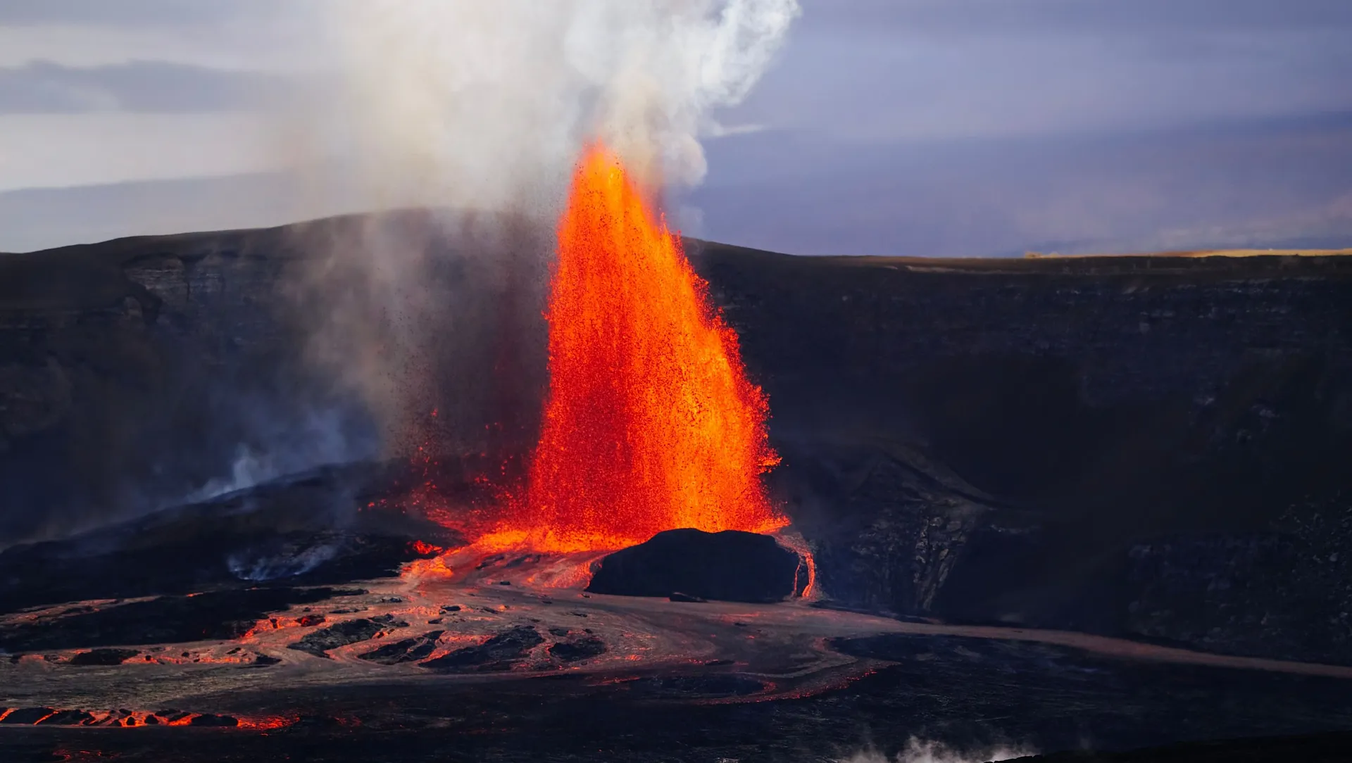 A powerful eruption at Kilauea Volcano in Hawaii sends lava and smoke into the sky.