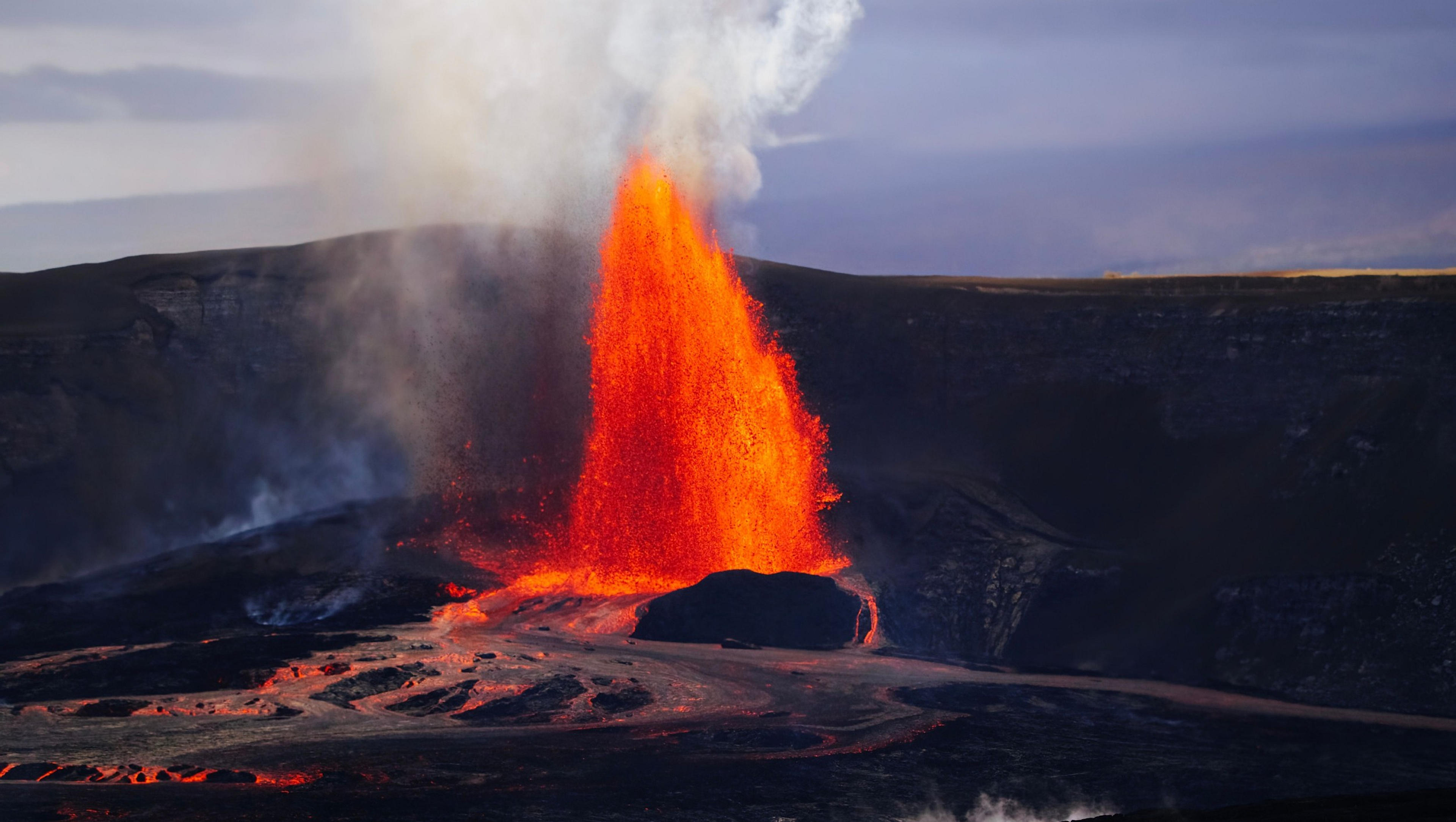 A powerful eruption at Kilauea Volcano in Hawaii sends lava and smoke into the sky.