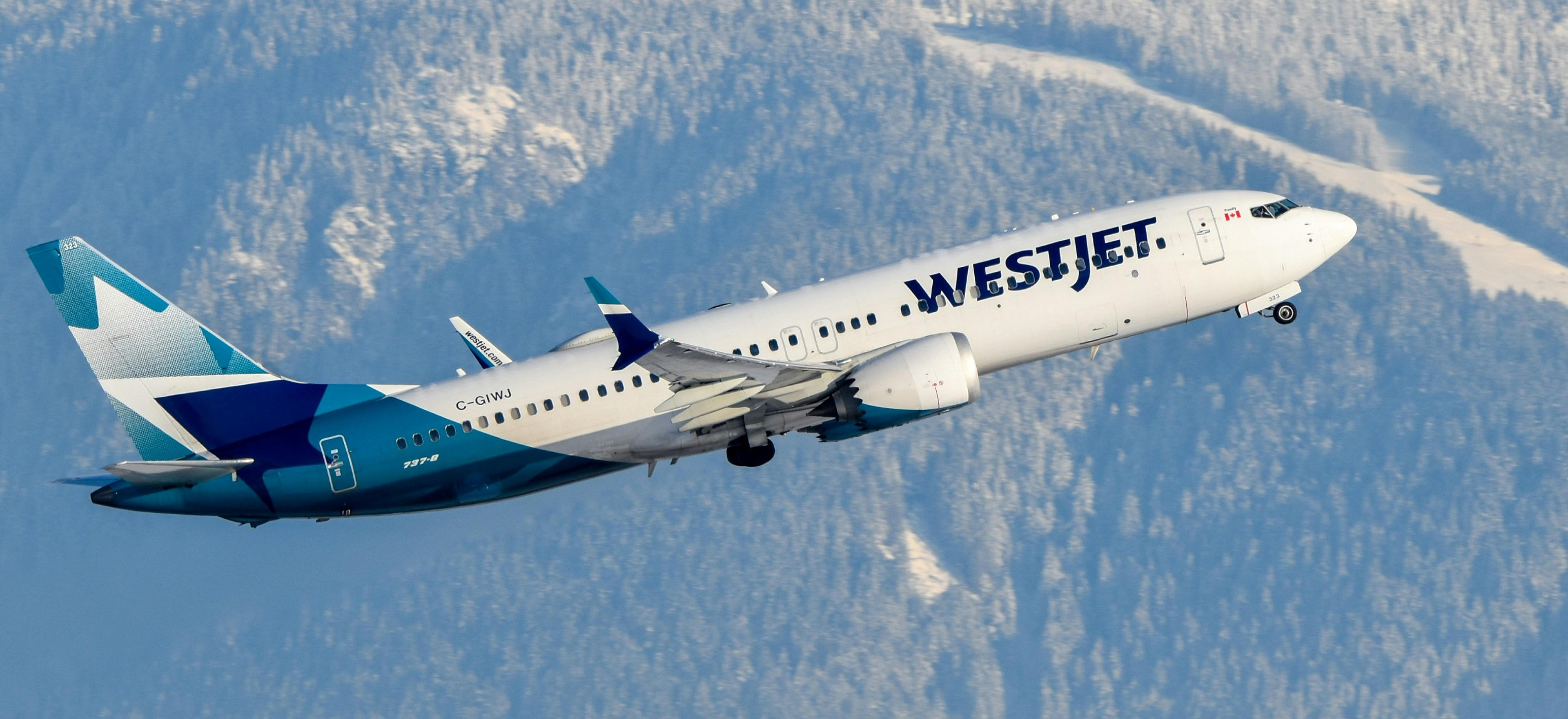 A WestJet airplane ascends against the snowy backdrop of Vancouver's Grouse Mountain.