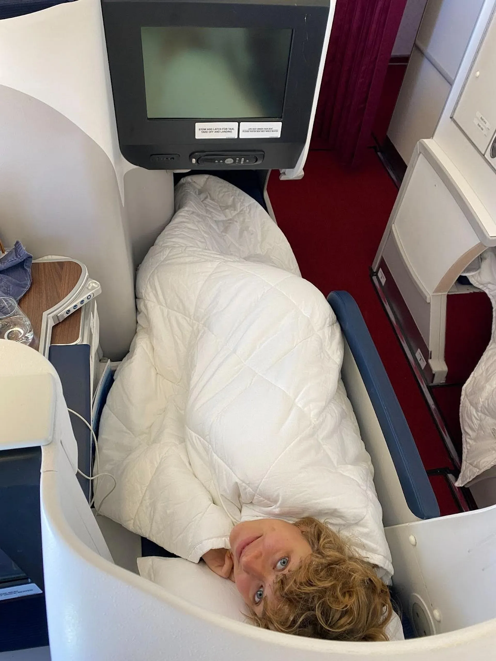 Fran lying flat in business class