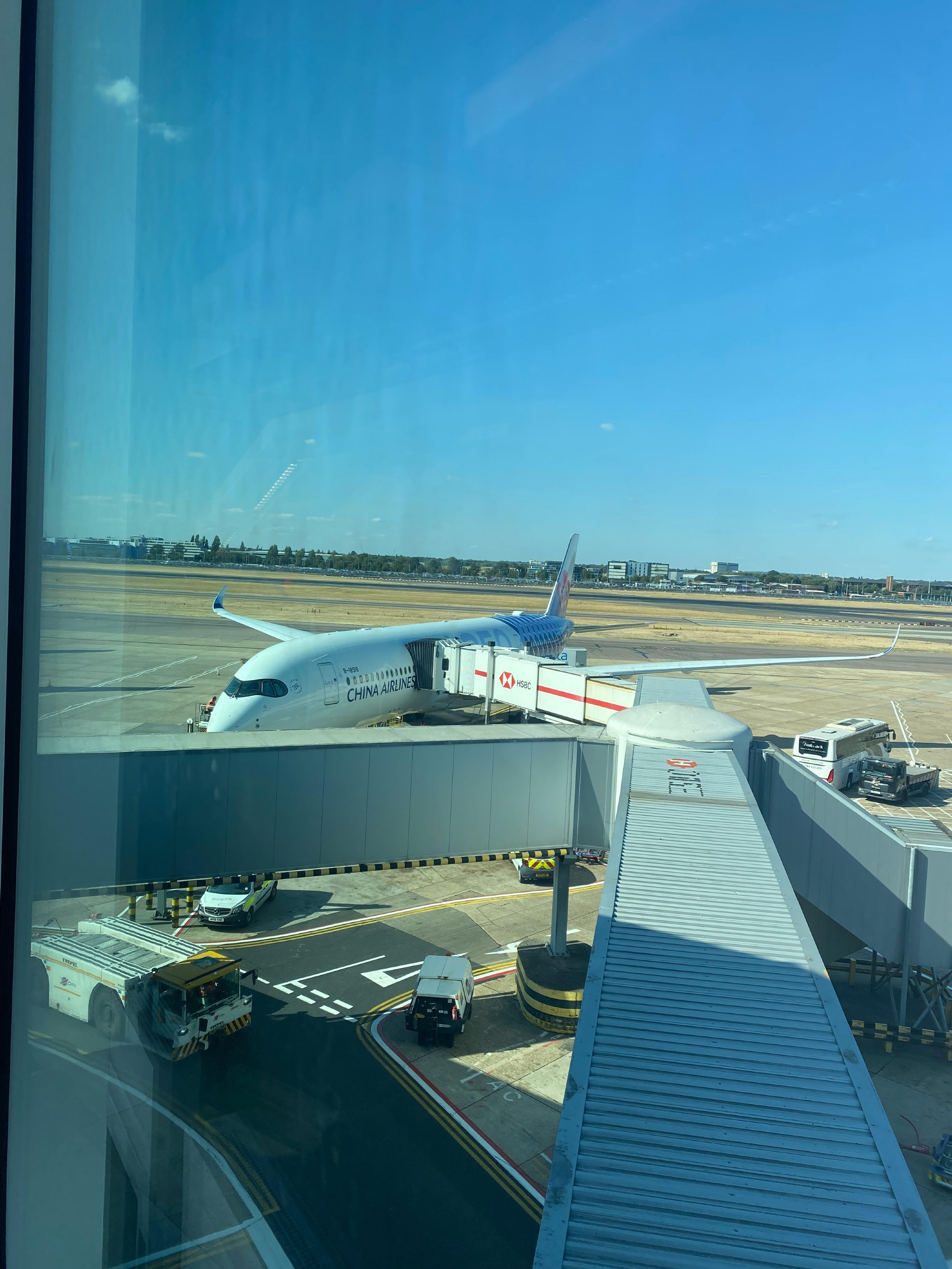 A China Airlines aircraft is connected to a jet bridge at Heathrow. 