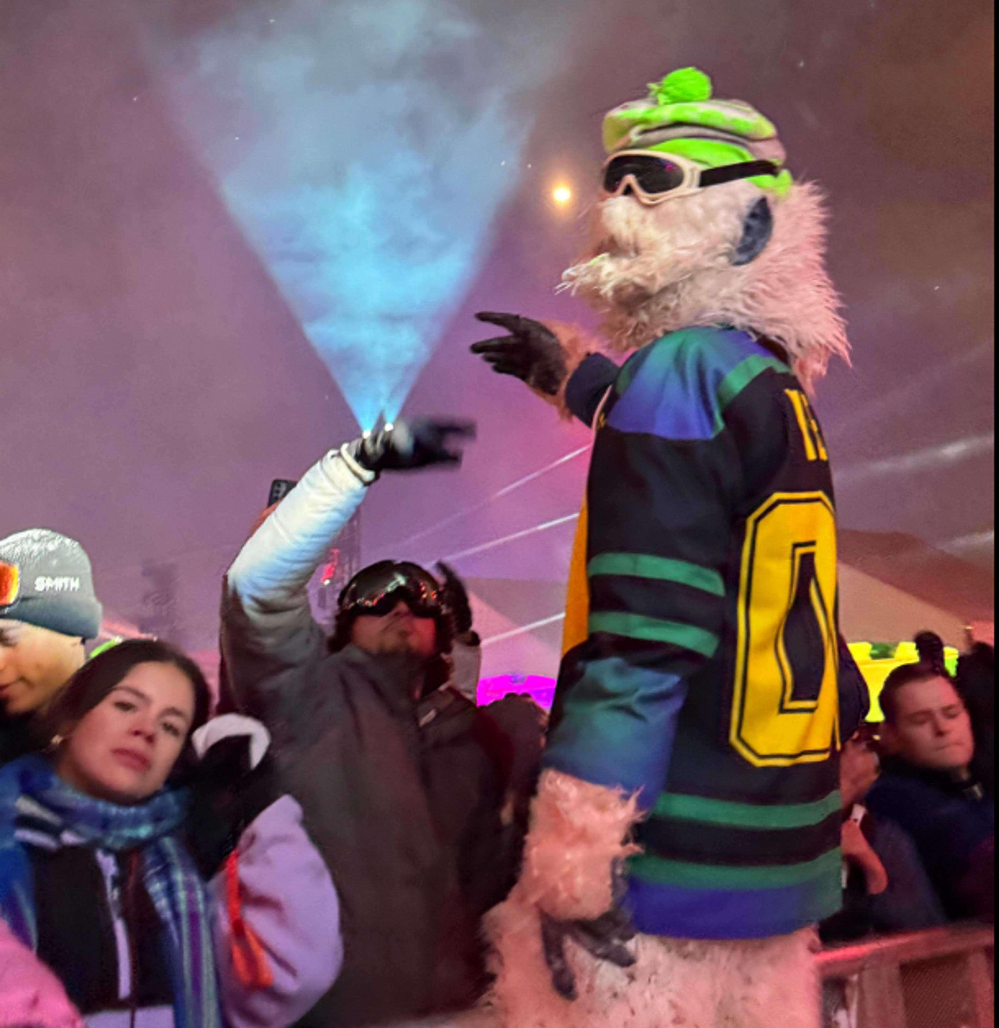 Igloofest abominable snowman mascot in front of crowd.