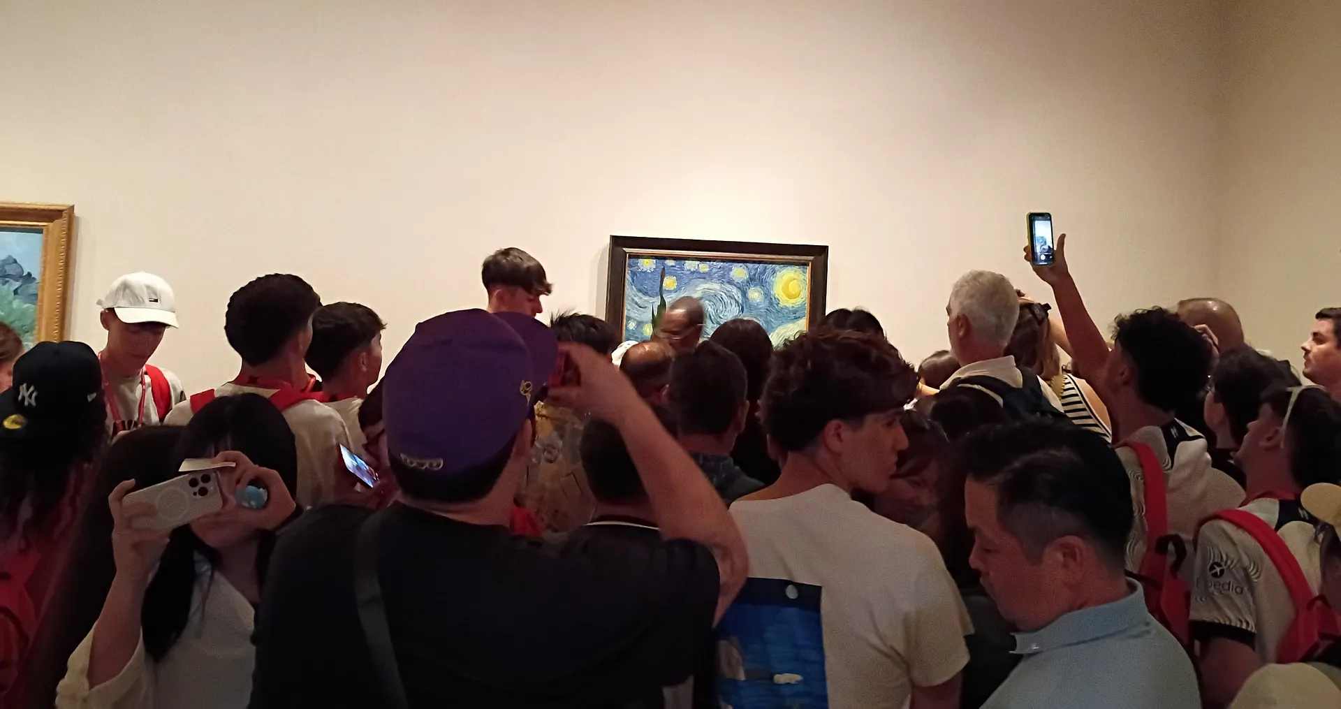 A crowd gathers at the Museum of Modern Art in New York to view Vincent van Gogh’s "Starry Night."
