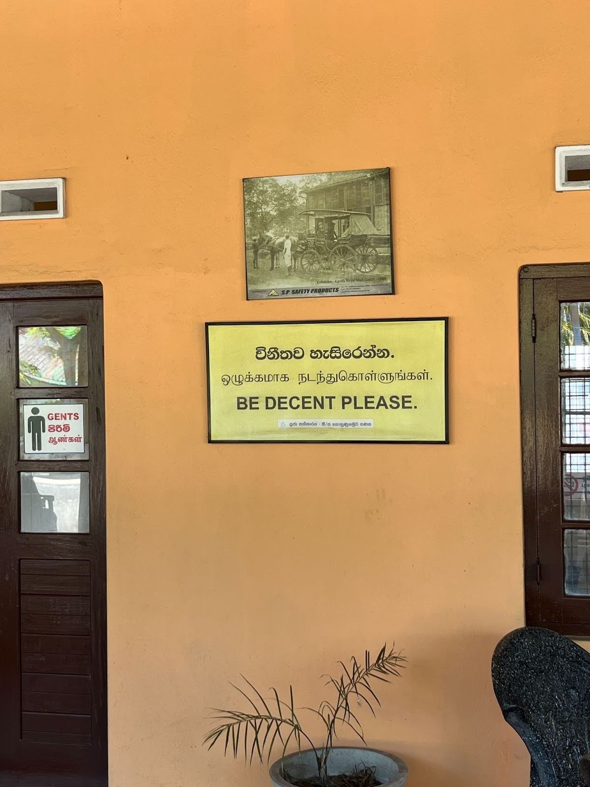 A sign at the Galle Railway Station in Sri Lanka politely requests people to "Be Decent Please."