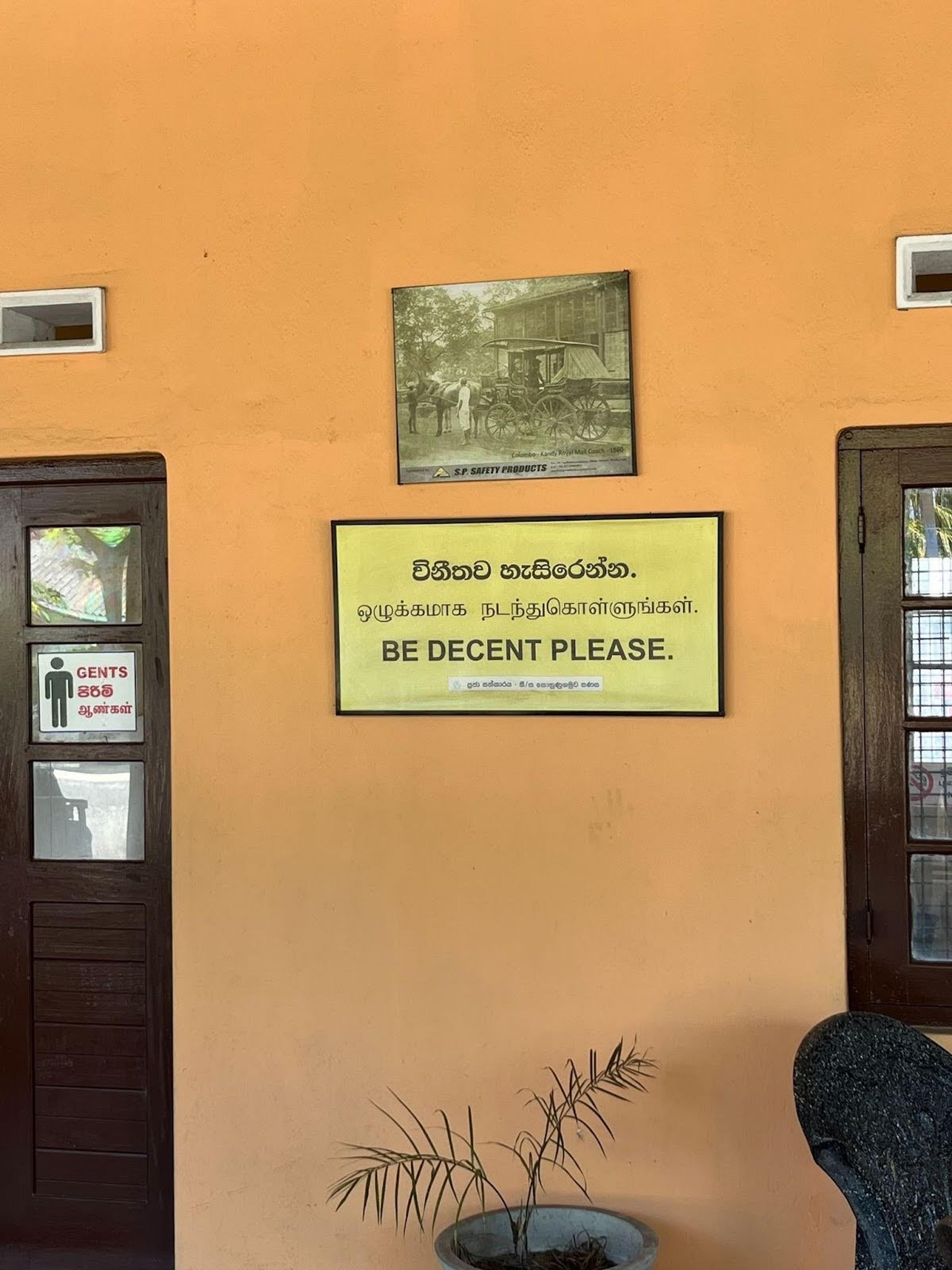 A sign at the Galle Railway Station in Sri Lanka politely requests people to "Be Decent Please."