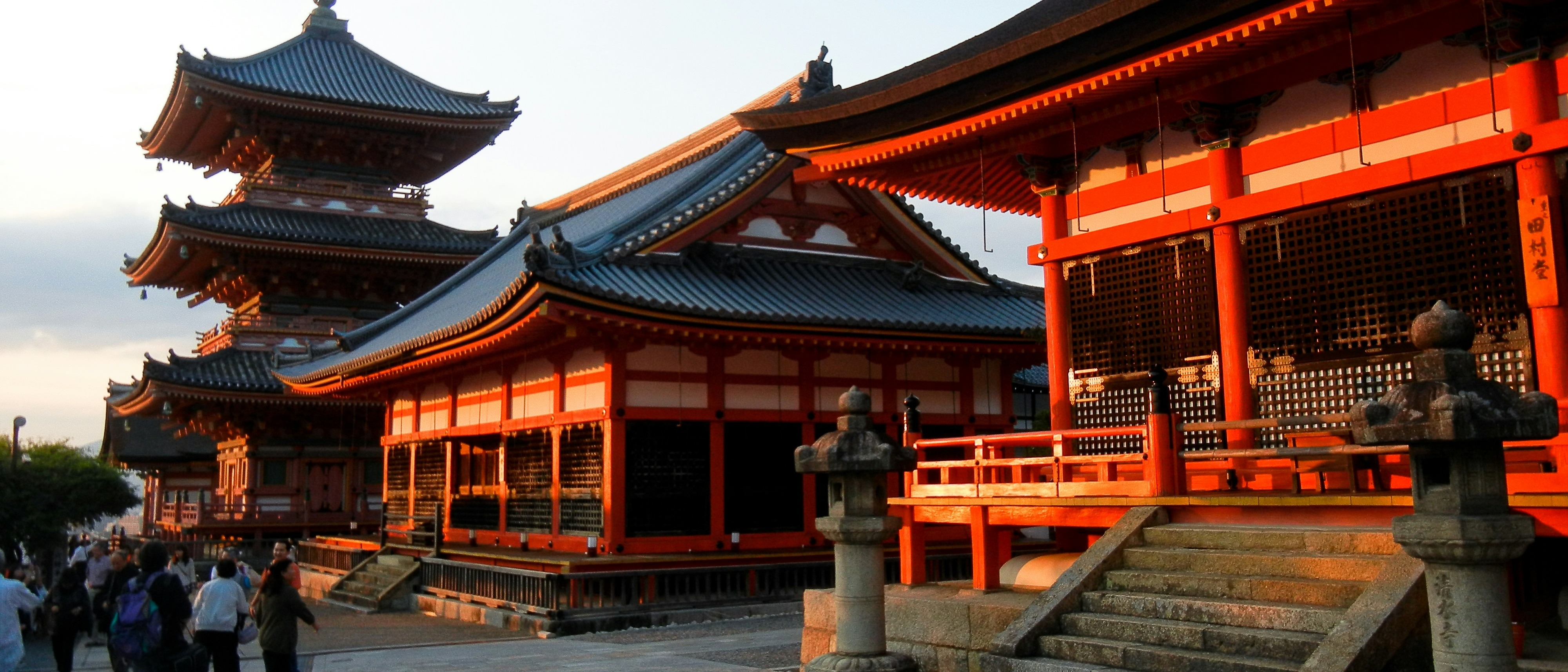 Kiyomizu-dera Temple in Kyoto, Japan, is illuminated by the warm glow of the setting sun.