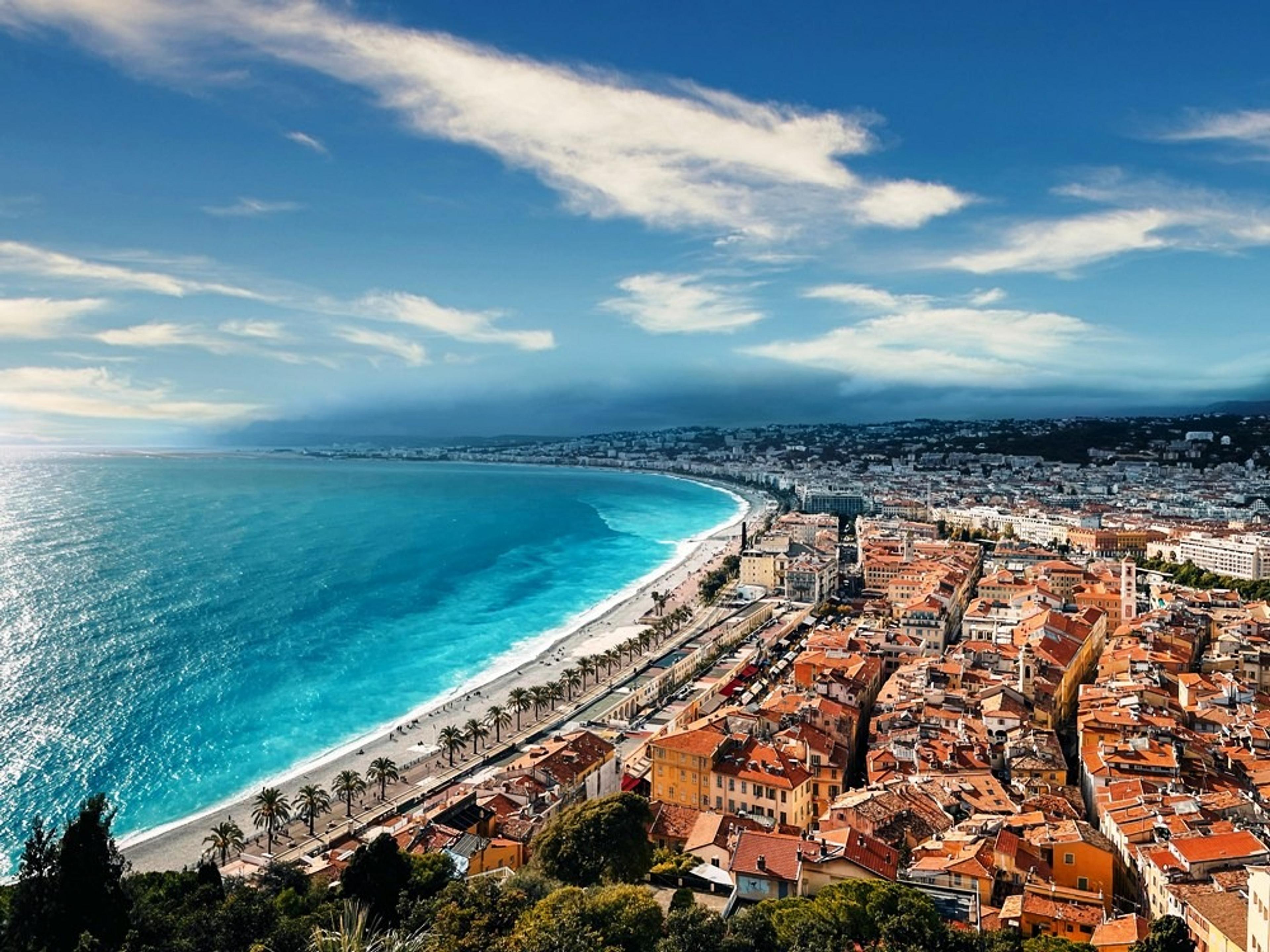 Nice, France, with its iconic Promenade des Anglais curving along the azure coastline.