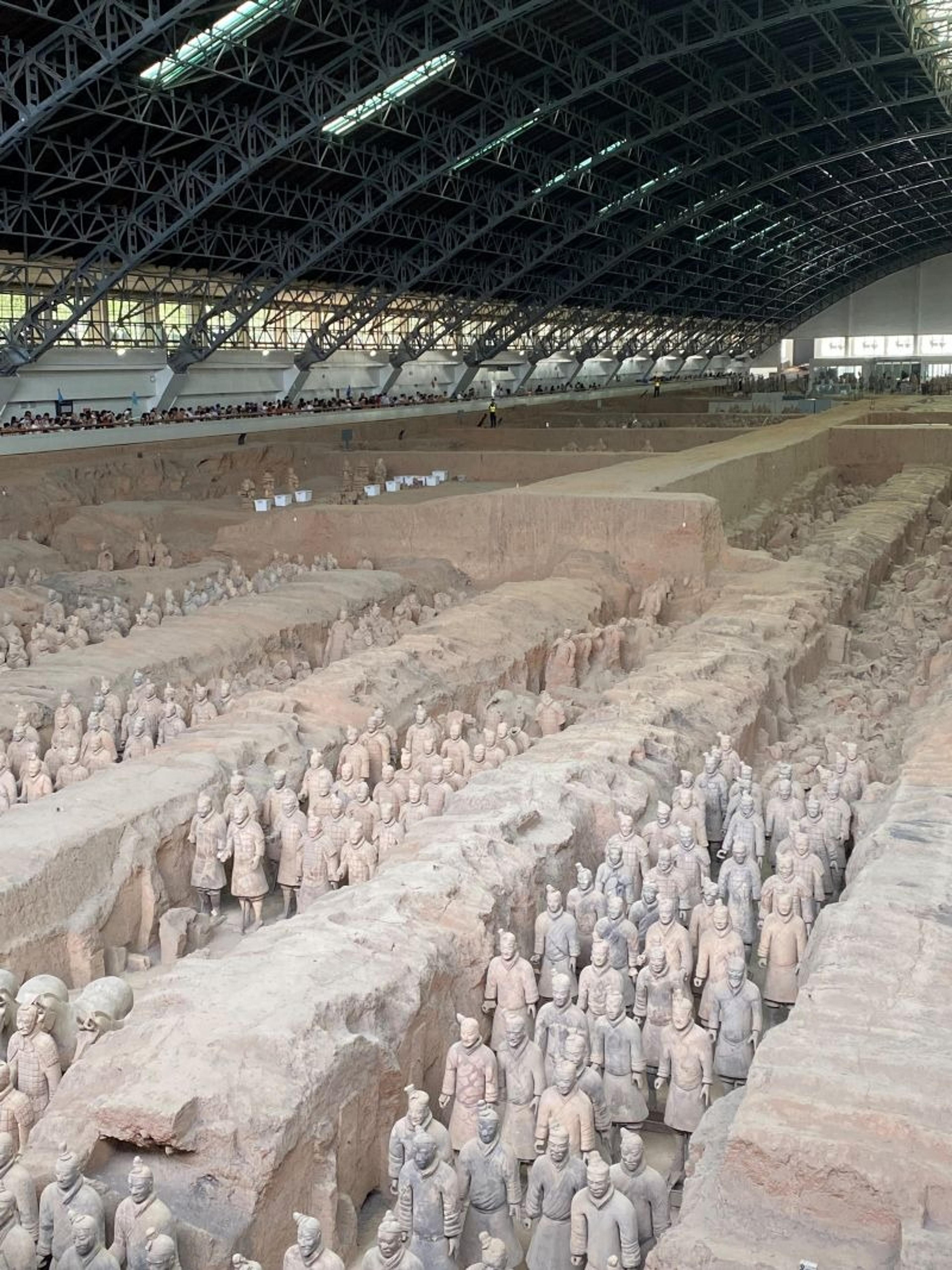Rows of Terracotta Warriors stand in the excavation site of Xi'an, China.