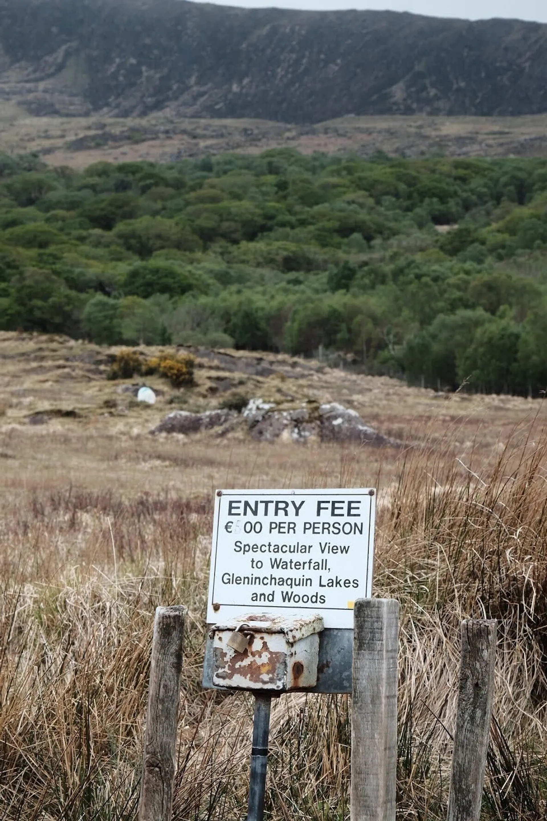 Worn sign with entry fee and honesty box